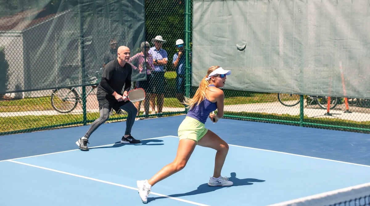 Andre Agassi and Anna Leigh Waters playing pickleball together.