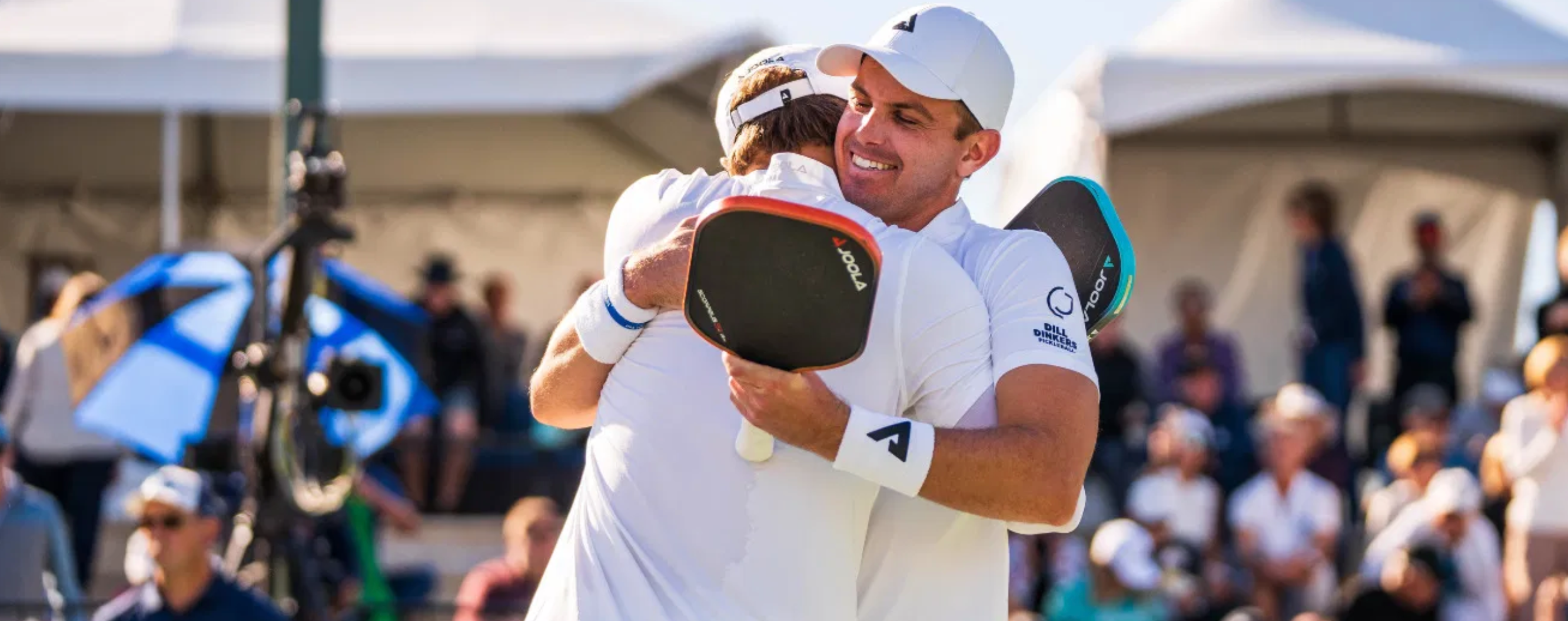 Ben and Collin Johns hug after a win on the PPA Tour