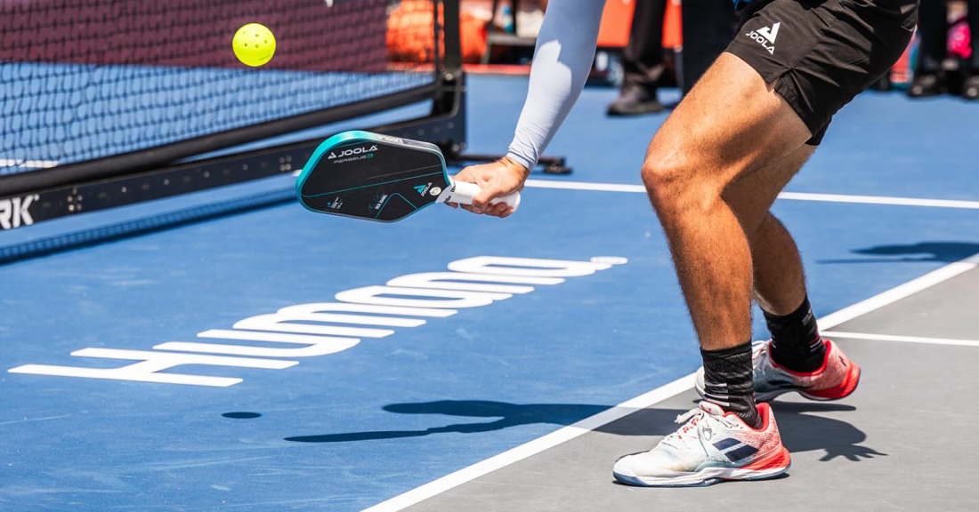 Ben Johns hits a pickleball.