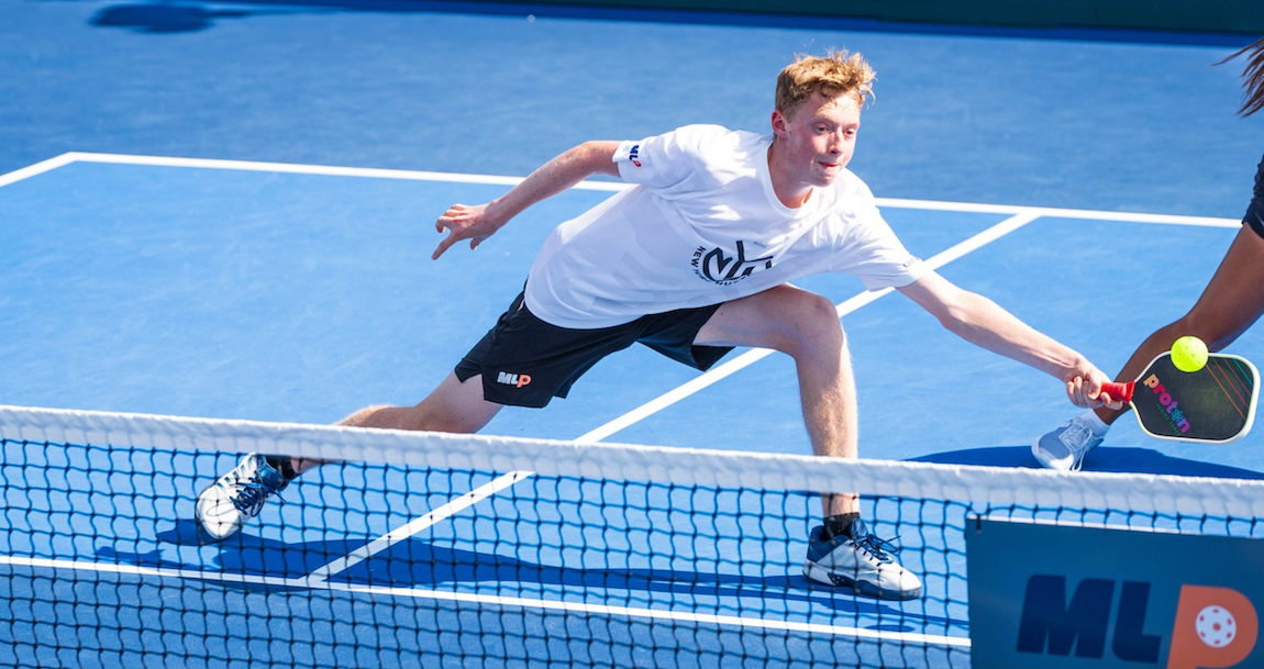 CJ Klinger reaches for a ball during a Major League Pickleball match.