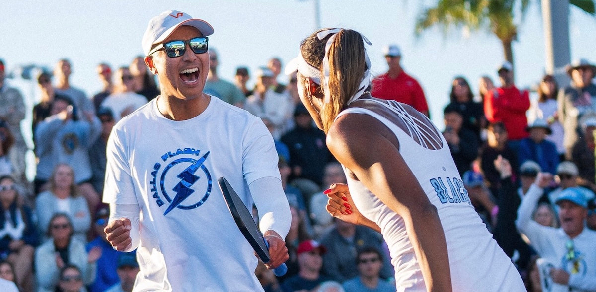 Augie Ge and Tyra Black of the Dallas Flash celebrate after a point during a Major League Pickleball match.
