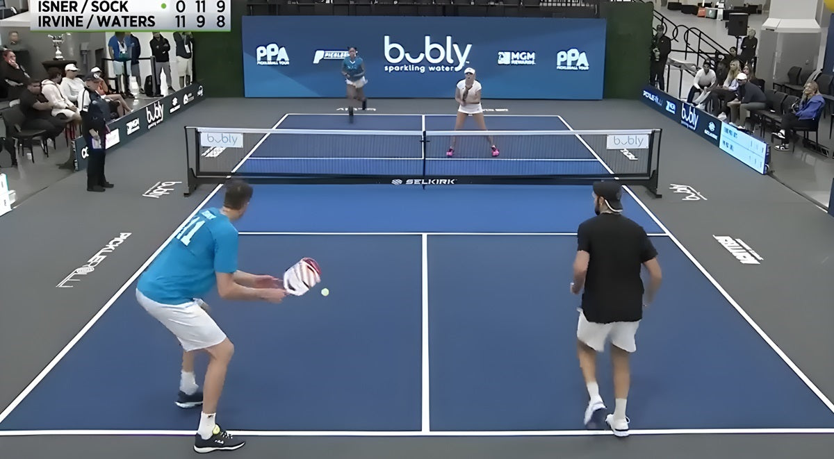 John Isner going for a "drip" on his third shot