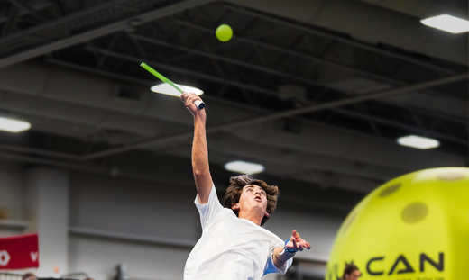 Gabe Tardio hits an overhead in pickleball.