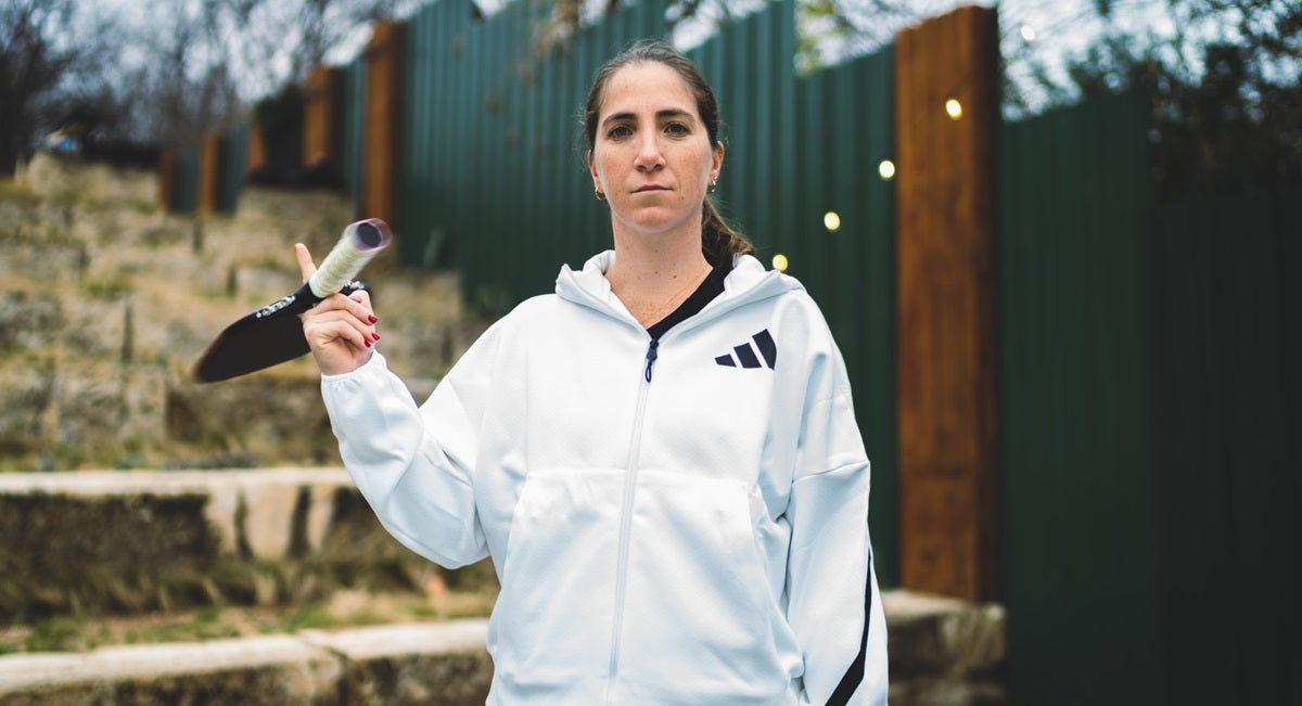 Mari Humberg poses with Adidas Pickleball activewear and a paddle.