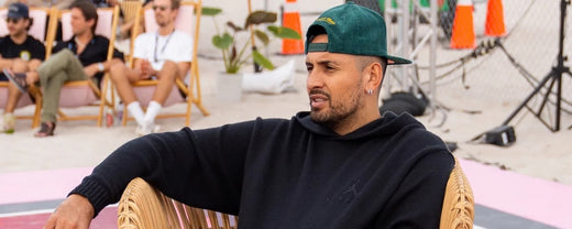 Nick Kyrgios sits in a chair