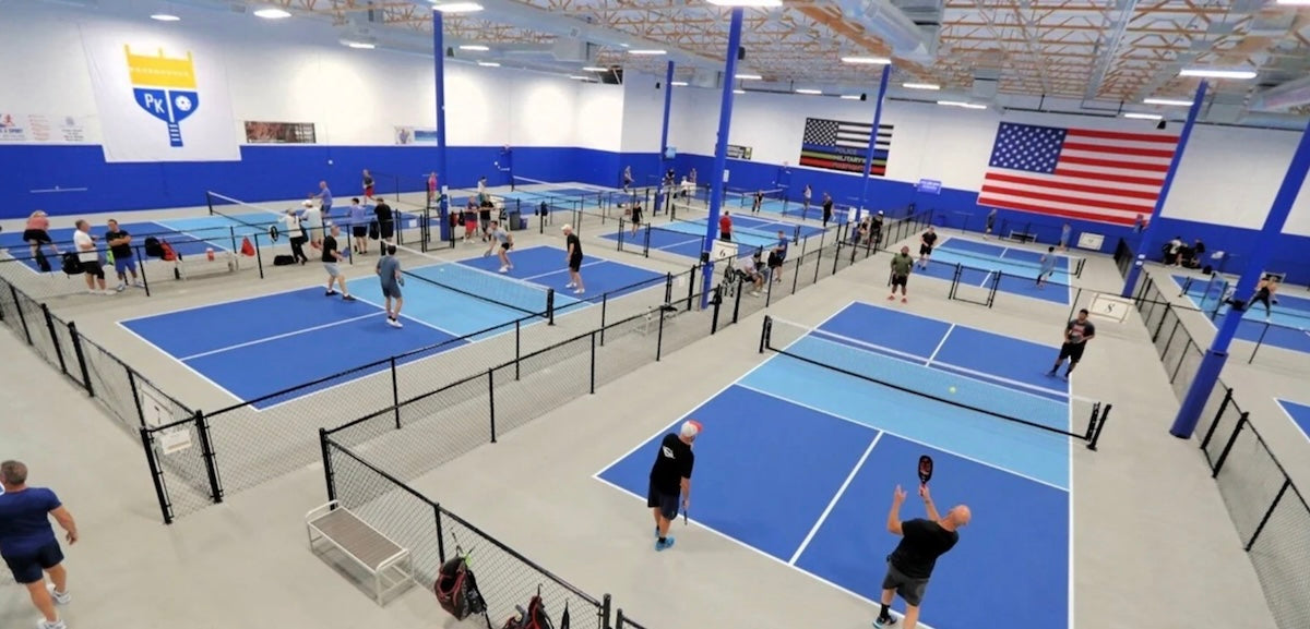 Pickleball players play at a Pickleball Kingdom location.