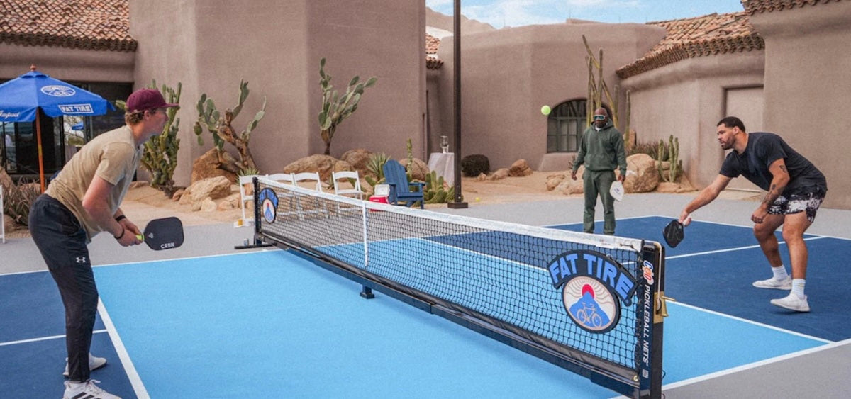 Players play pickleball at a private court.
