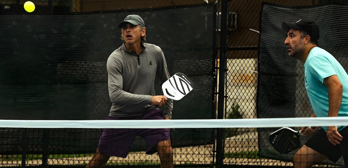 A pickleball player gets ready to hit a shot.