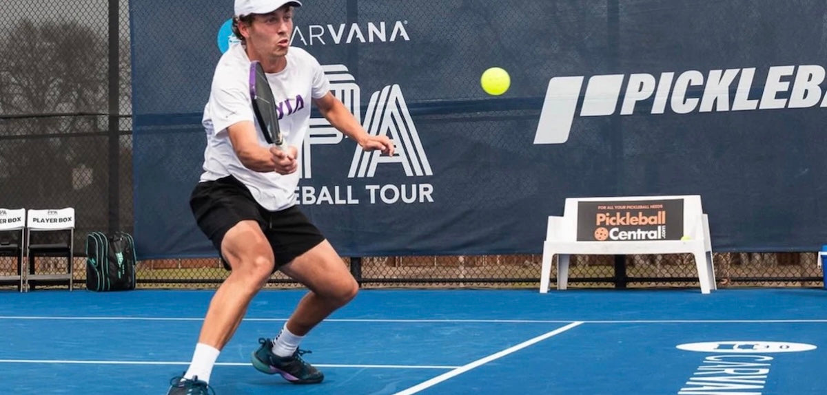 Pro pickleball player Connor Garnett hits a shot during a PPA Tour match.