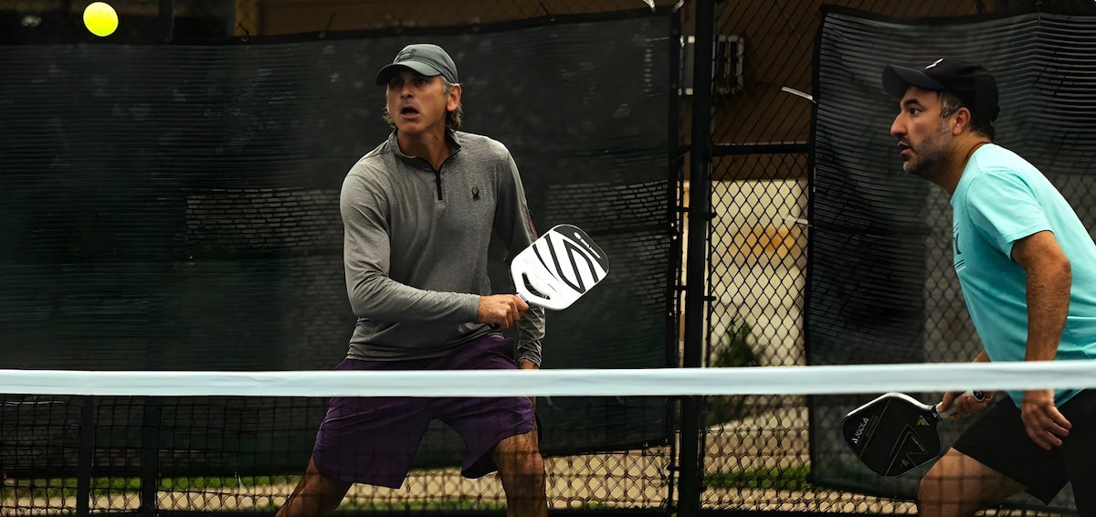 Two players play pickleball