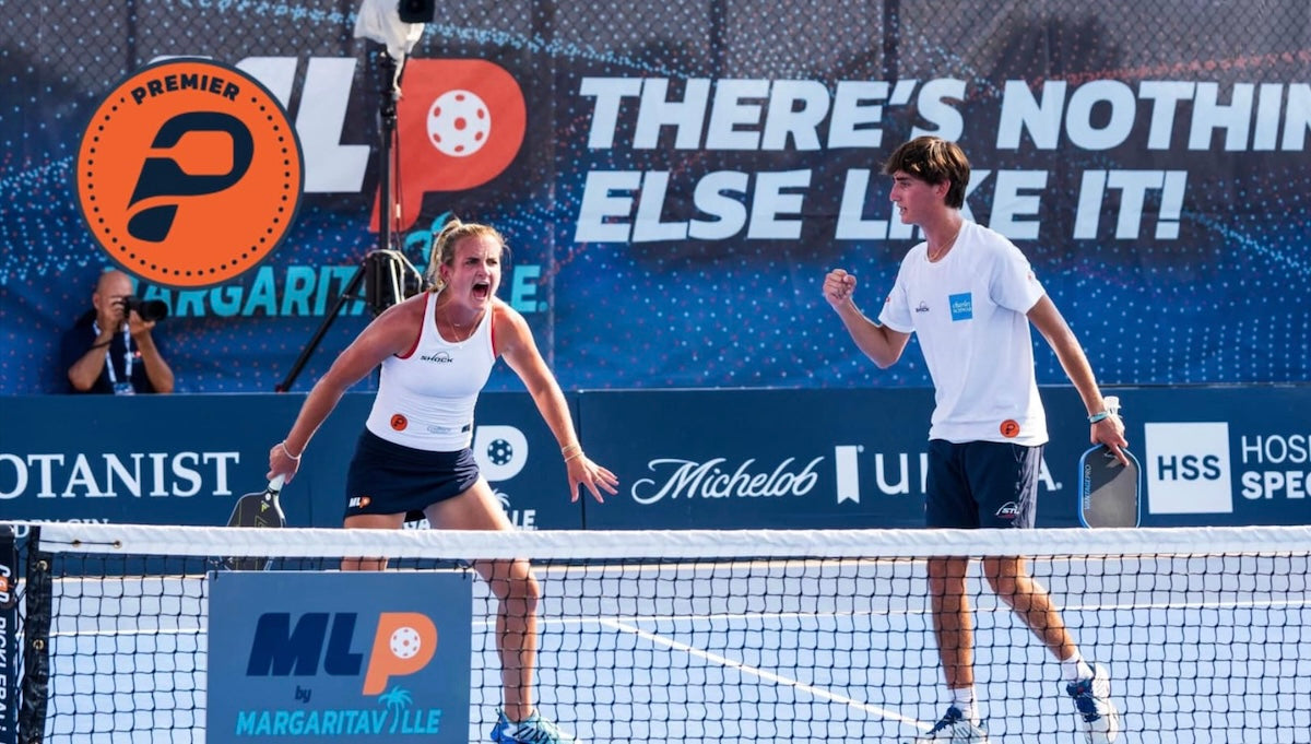 Kate Fahey and Gabe Tardio celebrate after a point in a Major League Pickleball match.