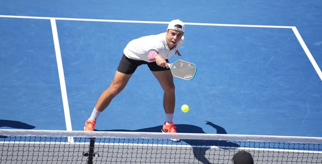 Pro pickleball player Ben Johns executing a backhand flick shot