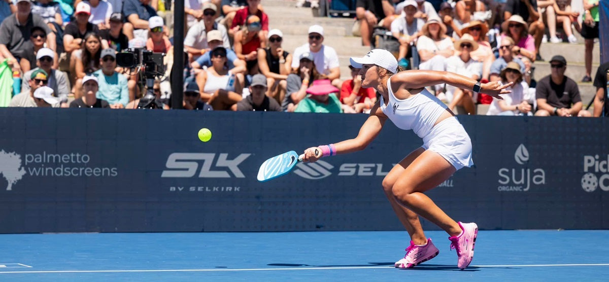 Catherine Parenteau performing a third shot drop in a pro pickleball match