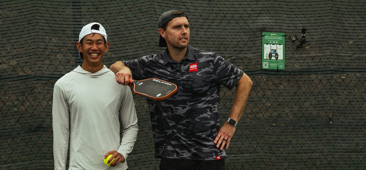 Two happy pickleball doubles partners after a match