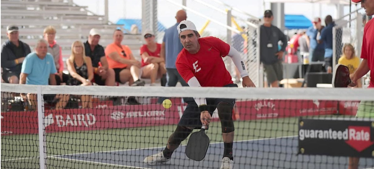 Dayne Gingrich playing at the kitchen line in a pickleball match
