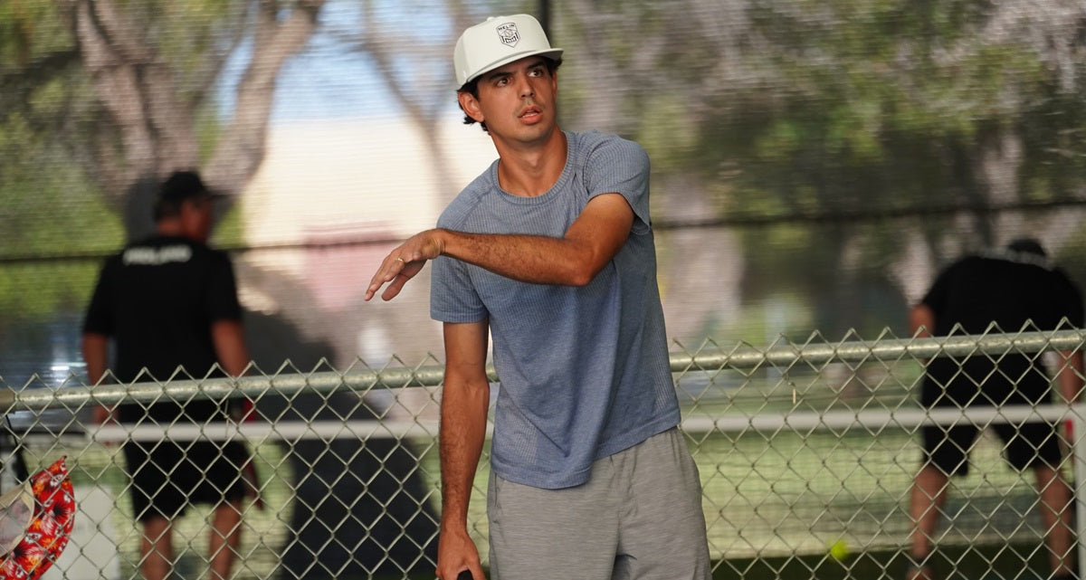 Author Frank Hines after hitting a pickleball with his paddle, improving his form