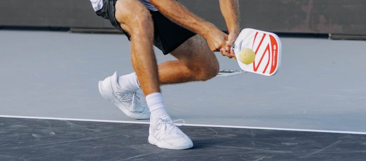 Image of a pickleball player's balanced legs as they approach a hit.