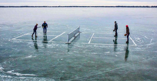 People playing pickleball on ice