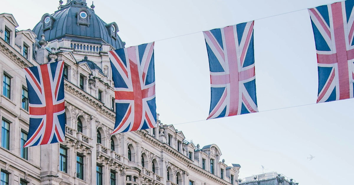English flags fly outside of a London building