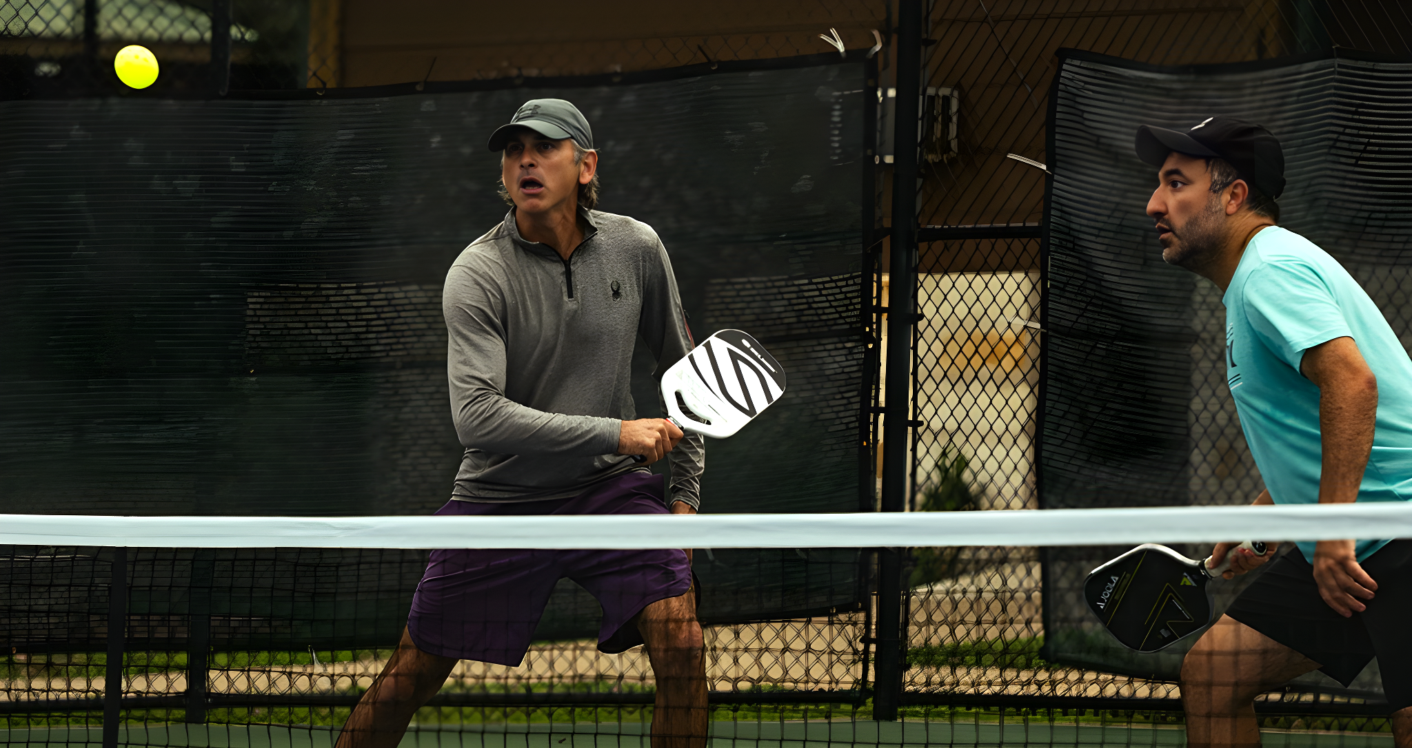 A pickleball player about to speed up on a high floating ball