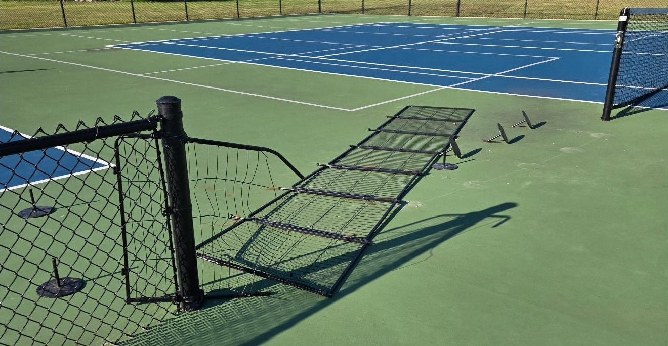 Vandalism at the pickleball court: court fencing destroyed