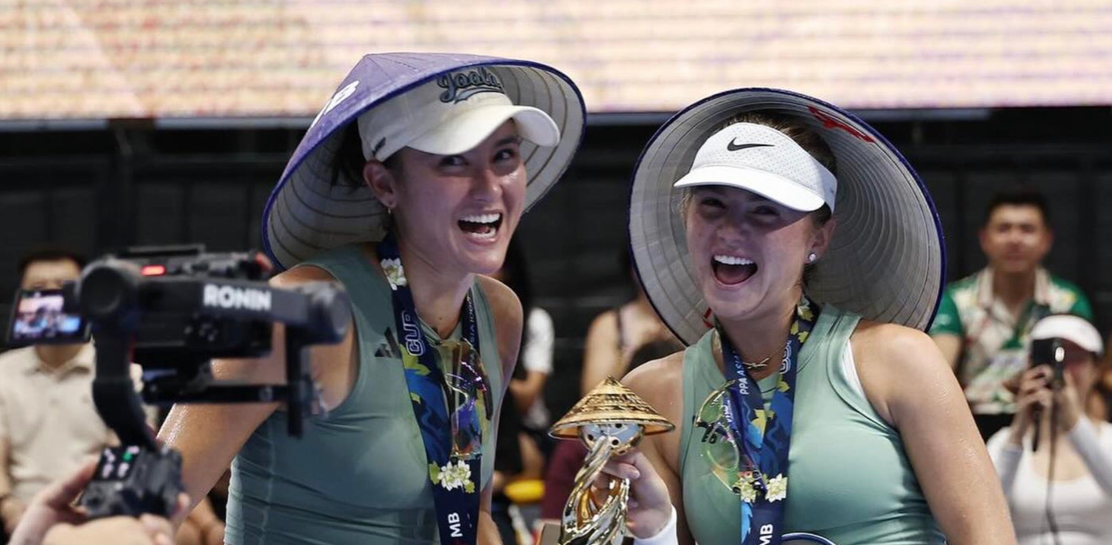 Anna Bright and Anna Leigh Waters celebrate after winning the MB Hanoi Cup in Vietnam.