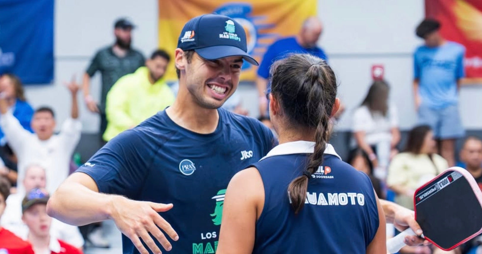 Ben Johns and Jade Kawamoto celebrate after winning a Major League Pickleball match in 2026.