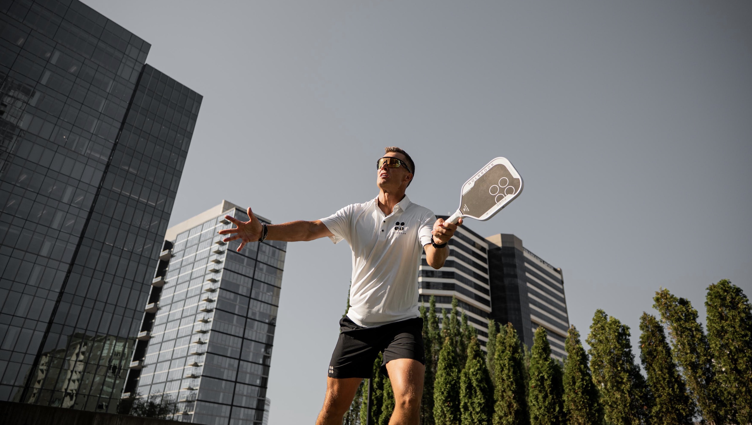 Pro player Martin Emmrich hits a shot with the new Holbrook Fuze pickleball paddle.