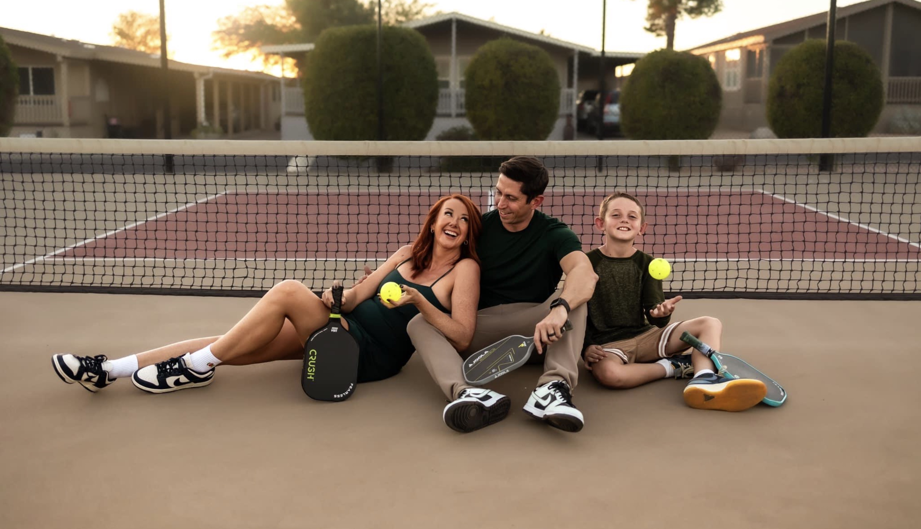 Mandy Holmes (left) poses for a photo with her son, junior pickleball player JZ Holmes (right).