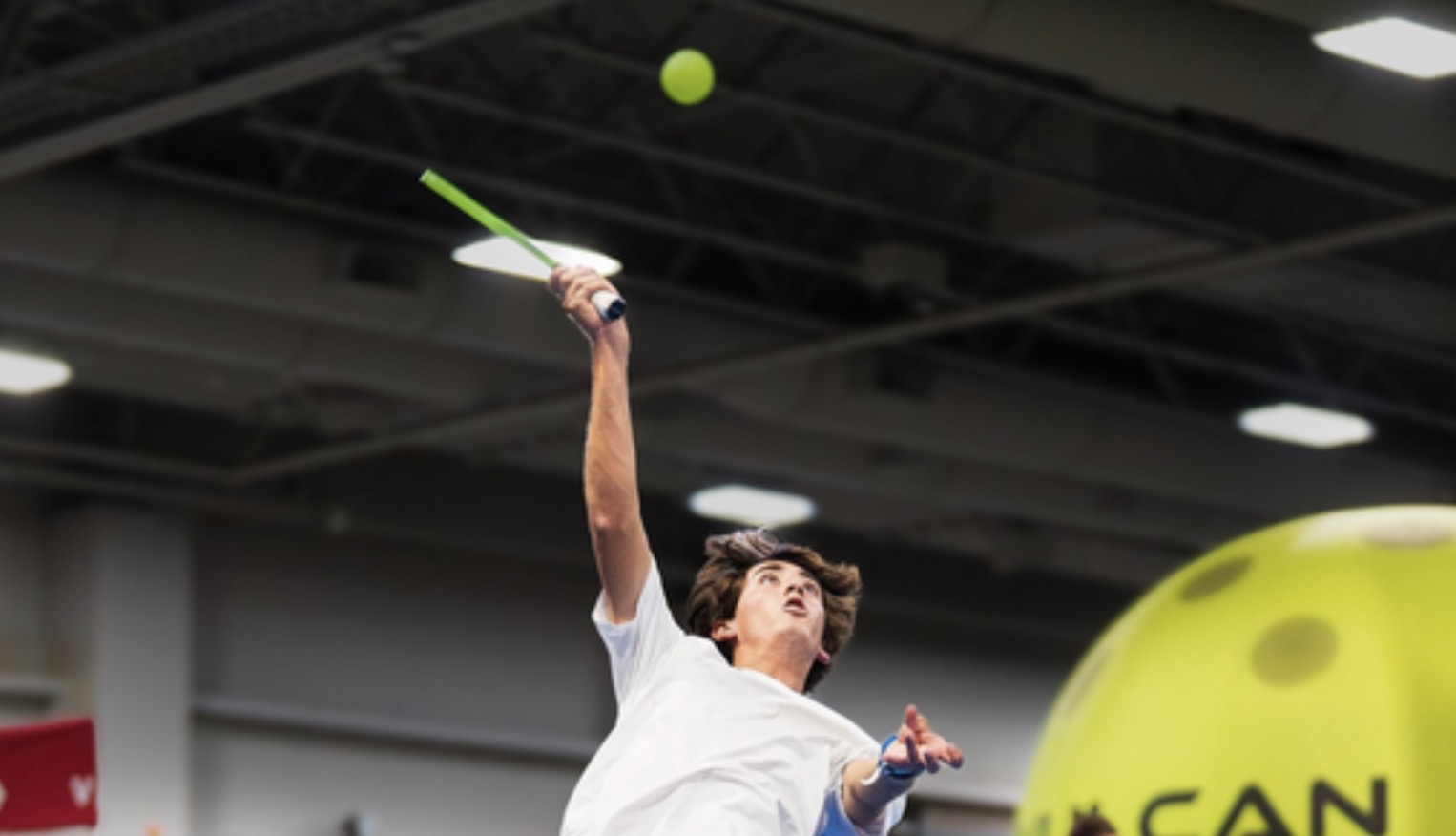 Pro pickleball player Gabe Tardio jumps for a lob.