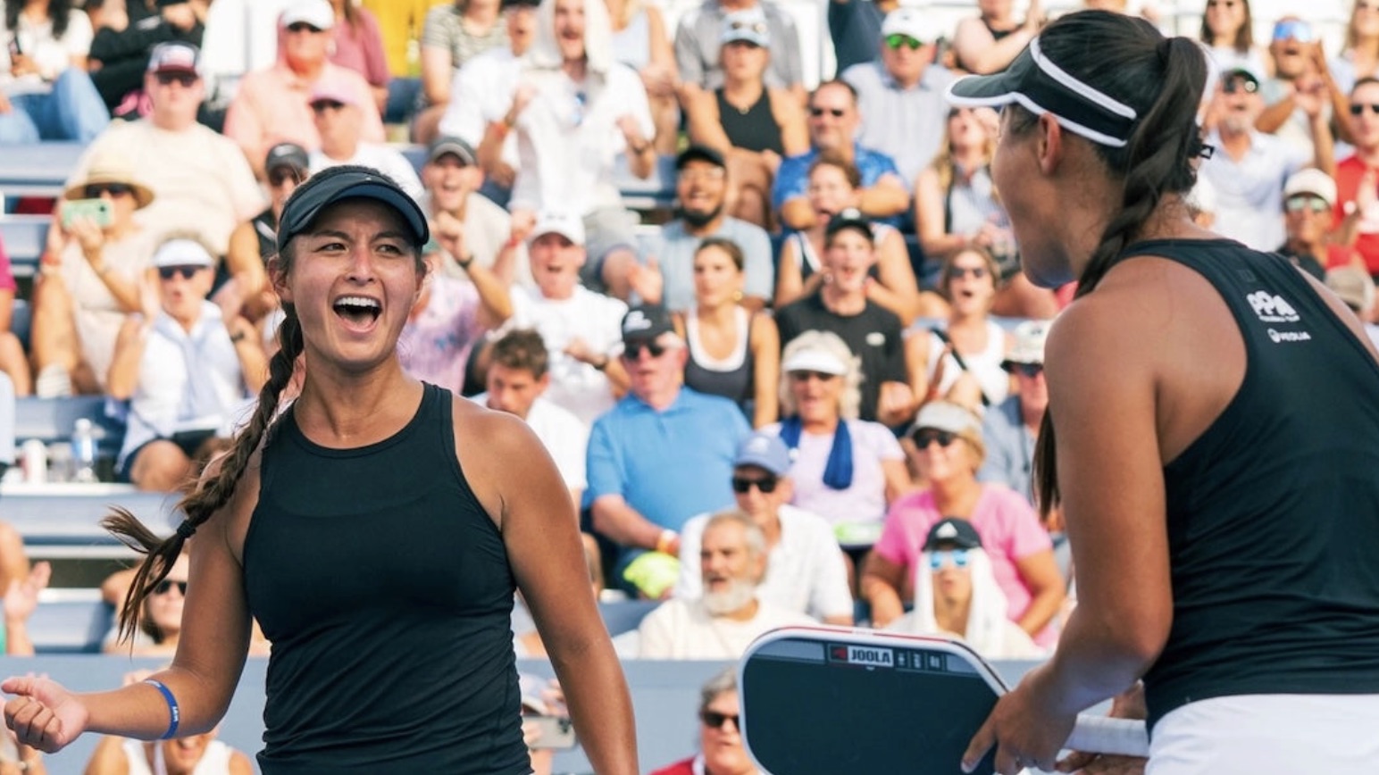 Jade Kawamoto and Jackie Kawamoto celebrate after winning a point during a PPA Tour match.