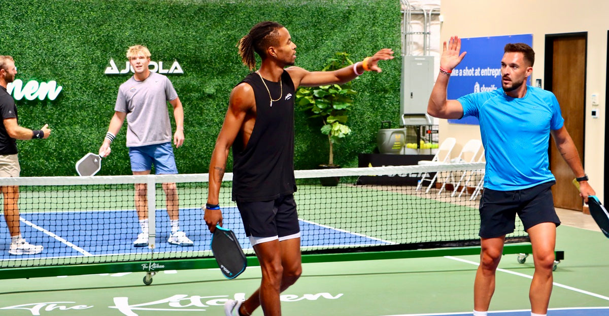 Pickleball partners celebrate after a point during the 2024 Kitchen Open.