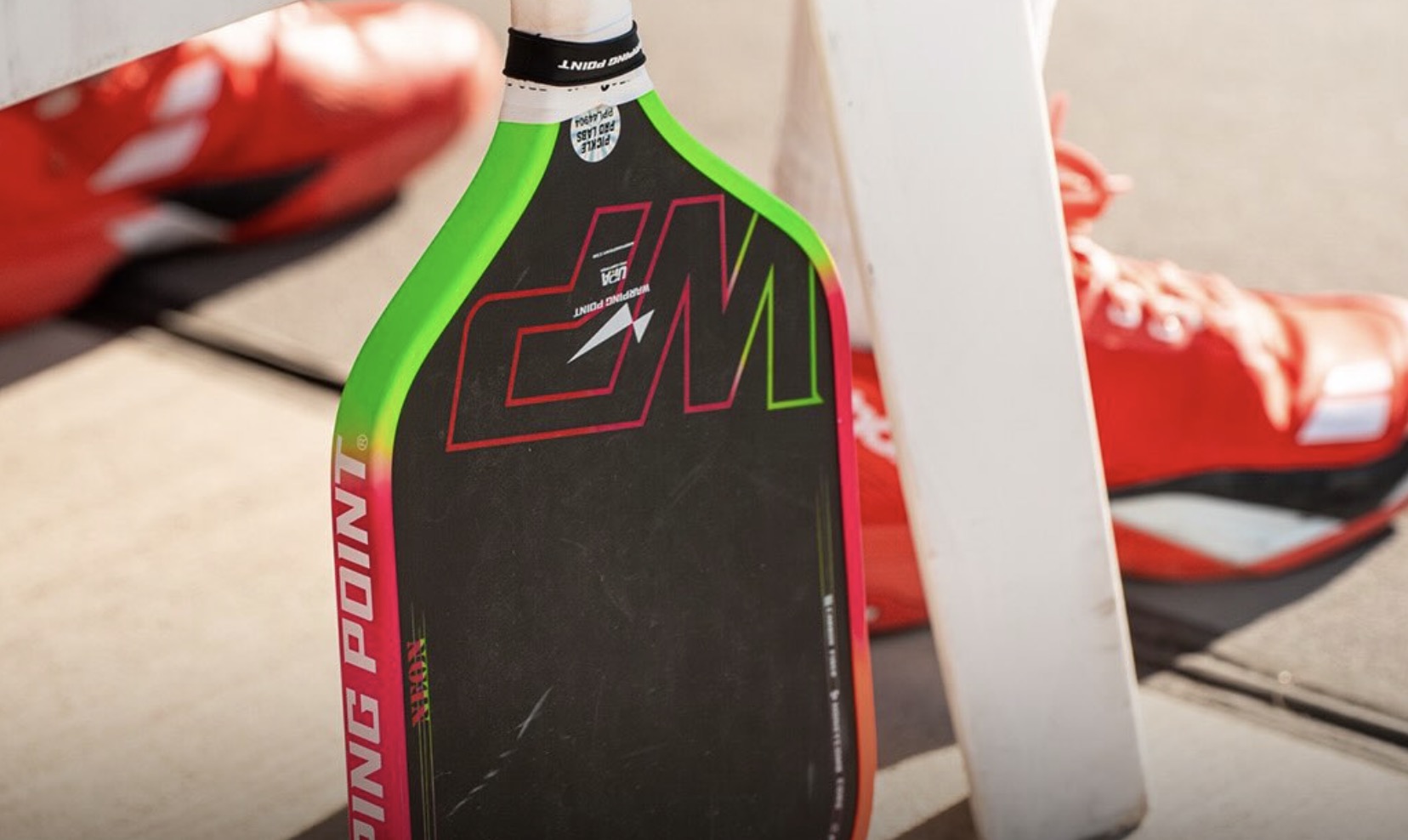 Warping Point Neon Pickleball paddle.
