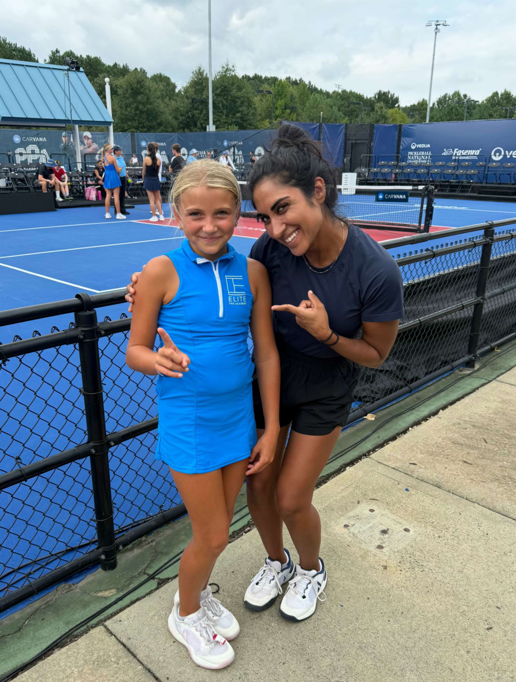 Junior player Maggie Wolf and JOOLA pro Mehvish Safdar.