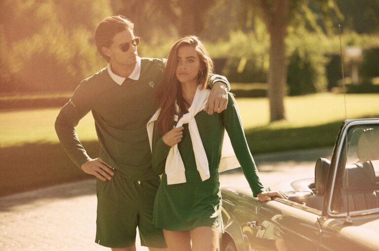 A young couple poses wearing J. Pritchard apparel.