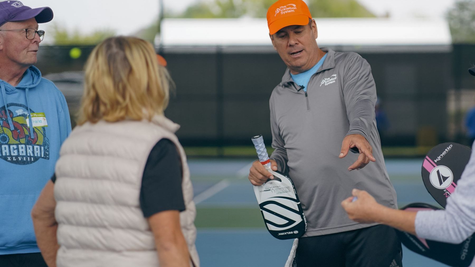 Tony Roig coaches pickleball players at one of his camps.